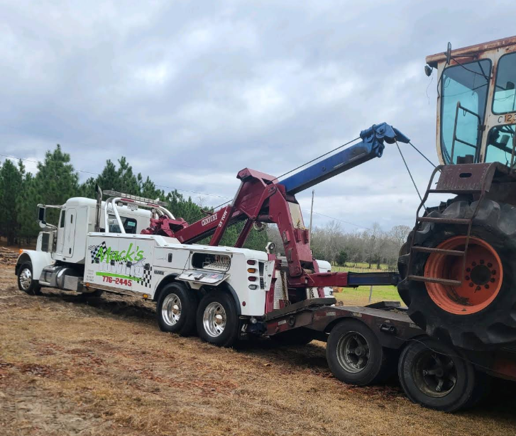 Mack's Towing heavy wrecker recovering a tractor